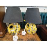 A pair of 1950s style yellow table lamps with black shades (2)