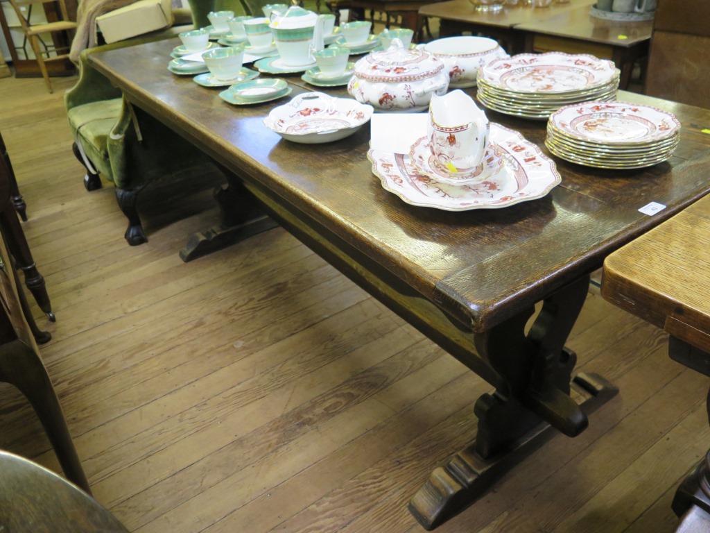 An oak refectory table, on baluster shaped fret carved supports and bracket feet, 77.5cm wide