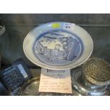 A Chinese underglaze blue dish, depicting a figure by a fence 18.5cm diameter, with Harrods ticket