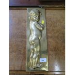 A brass plaque depicting a child in relief, possibly Austrian, 42.5 x 13cm