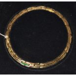 An 18 carat gold emerald and diamond collarette, the centre of the collarette features seven 1.7mm