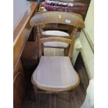 A pair of Victorian beech bedroom chairs, the rail backs with striped upholstered seats on