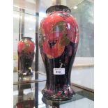 A Moorcroft Pottery Pomegranate pattern baluster vase, 31.5cm high, painted green signature and