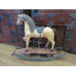 A small painted horse on wheels early 20th century, now mounted on rockers 66cm high