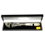 A cased silver butter knife with mother of pearl handle, Birmingham 1860