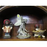 A moulded figure of a garden fairy together with two moulded Blackamoor figures