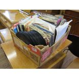 A collection of 7" vinyl records mostly 1980s