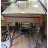 An Edwardian inlaid rosewood envelope card table, the square top with urn marquetry flaps, over a