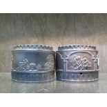 Two early 19th century Turner black basket tea caddies of ovoid form with presed decoration,