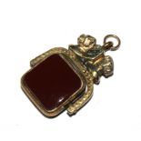 A Victorian carnalian and bloodstone silver fob with head of a mastiff