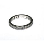 A platinum and diamond eternity ring, by Tiffany & Co., set with twenty eight round brilliant cut