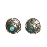 A pair of Liberty & Co London Cymric silver buttons set with a cabochon turquoise stone,