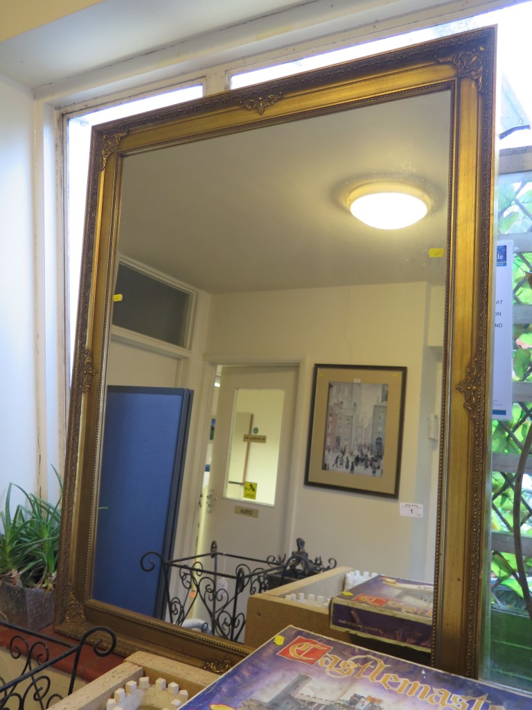 A giltwood framed rectangular wall mirror 118cm x 90cm