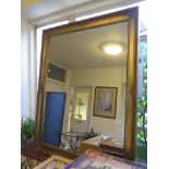 A giltwood framed rectangular wall mirror 118cm x 90cm