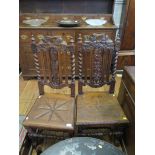 A pair of Victorian carved oak hall chairs, the backs carved with grape vines, on barley twist