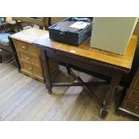 A pine bedside cabinet with three drawers on bracket feet 45.5cm wide and an oak drawleaf dining