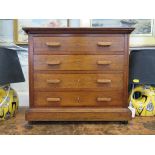 A mahogany table top chest, with four long drawers on a plinth base and peg feet 47cm wide