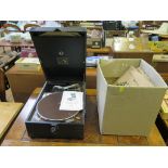 A HMV portable gramophone player and a selection of records
