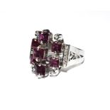 A pink sapphire and diamond ring set in 18 carat white gold