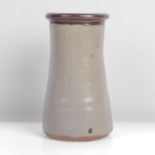 Bernard Leach (British, 1887-1979) Cylindrical Vase Stoneware, oatmeal glaze with iron interior