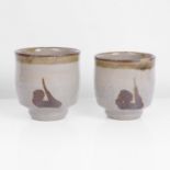 Hamada Shinsaku Meoto Yunomi Stoneware, each with a layered cream over pale green ash glazes with