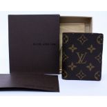 A BLACK SQUARE ACROSS BODY BAG and a Louis Vuitton monogram wallet in box (2)