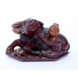 AN ANTIQUE CHINESE, POSSIBLY AMBER, FIGURE OF A WATER BUFFALO 8cm wide