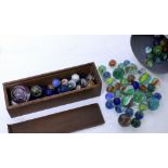 A SELECTION OF VINTAGE MARBLES to include a large antique hand made Latticinio swirl marble, others,