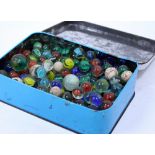 A SELECTION OF VINTAGE MARBLES of various styles, colours and age, in a tin (a quantity)