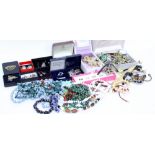 A BOX OF COSTUME JEWELLERY to include necklaces, rings, brooches, bead necklaces, costume earrings