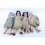 A GROUP OF FOUR CONTINENTAL 19TH CENTURY BISQUE HEADED DOLLS the largest 33cm high (4)