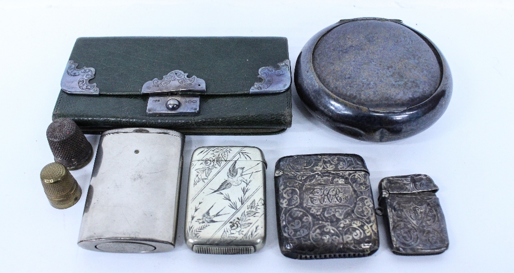 A SILVER PLATED SNUFF BOX an engraved silver vesta case, an unmarked white metal vesta case with