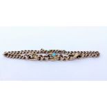 A VICTORIAN 9CT GOLD BRACELET with an inset turquoise stone