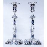 A NEAR PAIR OF SILVER KNOPPED CANDLESTICKS on spreading bases, 25.5cm high, one marked for