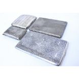 THREE SILVER CIGARETTE CASES with engine turned decoration and foliate engraved decoration, and