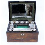 A 19TH CENTURY BURR WALNUT VANITY CASE the mirror lined lifting top, opening to reveal cut glass