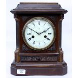 AN EARLY 19TH CENTURY GERMAN WALNUT CASED MANTLE CLOCK the movement striking the hours on a gong,