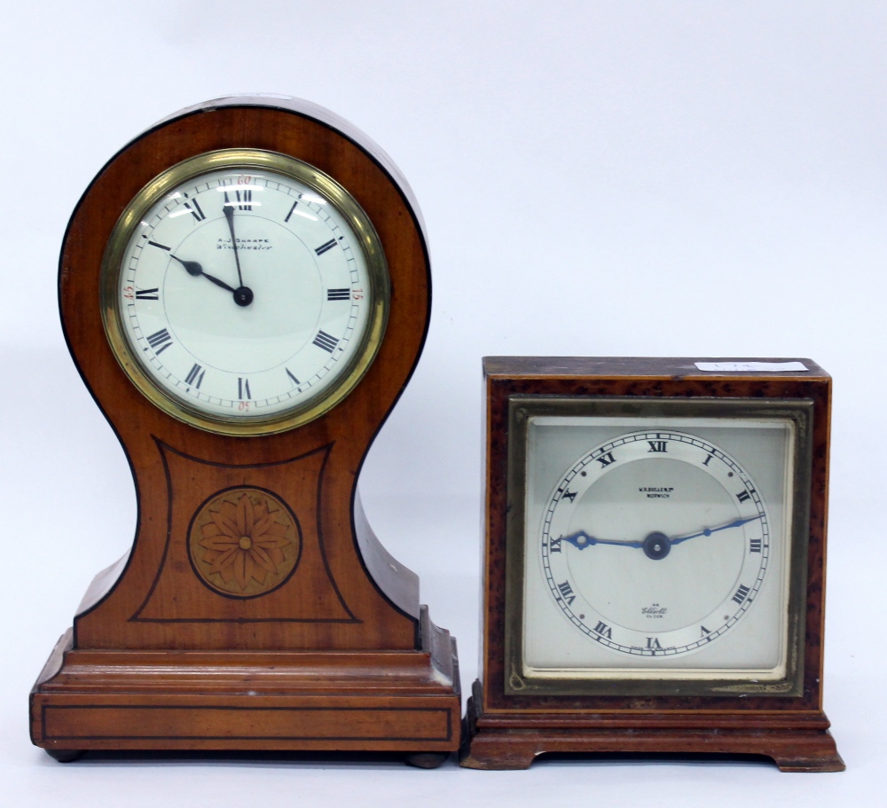 A SATINWOOD CASED BALLOON SHAPED MANTLE CLOCK or timepiece, the dial with Roman numerals and