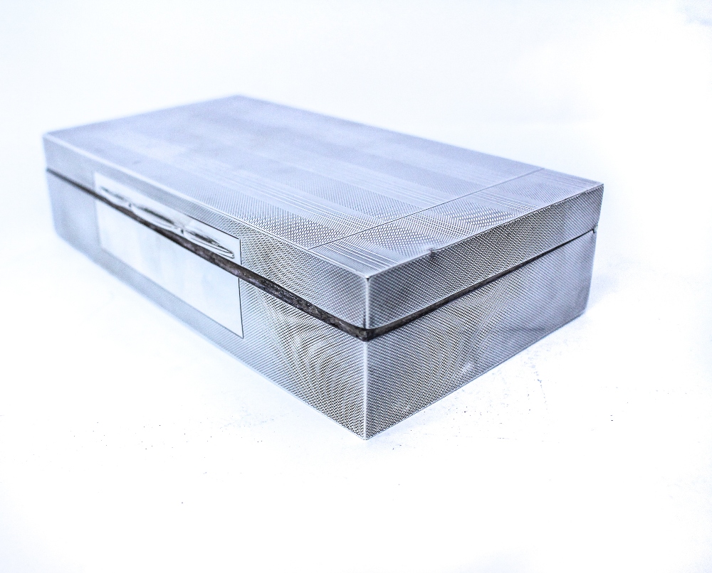 A BIRMINGHAM SILVER TABLE TOP BOX with engine turned band decoration and wooden base and