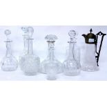 A CUT GLASS SHIP'S DECANTER with a silver collar, six further glass decanters and a claret jug