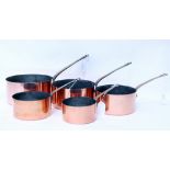 A SET OF FIVE FRENCH GRADUATED COPPER SAUCEPANS the largest measures 38cm overall (5)