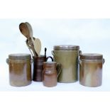 THREE FRENCH STONEWARE STORAGE JARS with luster glaze, a matching jug and one other jug, the largest