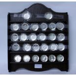 A FRANKLIN MINT 'FLORAL ALPHABET' SILVER MINIATURE PLATE COLLECTION and original display rack 30.5cm