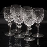 A SET OF SIX WATERFORD CRYSTAL WATER GOBLETS with hobnail cut decoration and faceted stems, with