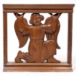 AN OLD, POSSIBLY FLEMISH, PITCH PINE CARVING in the form of an angel, 81cm wide x 77.5cm high