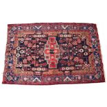 A LATE 20TH CENTURY HAMADAN RED GROUND RUG with geometric decoration 140cm x 210cm