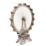 A LARGE DECORATIVE PAINTED IRON SCULPTURE in the form of a ferris wheel, the spoked wheel with