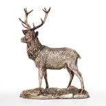 A MODERN FILLED SILVER SCULPTURE depicting a stag standing alert, with hallmarks to the base, 26.5cm