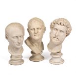 A GROUP OF THREE COMPOSITE BUSTS after the antique of Roman emperors, each on a socle base, the