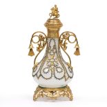 A LATE 19TH / EARLY 20TH CENTURY OPALINE GLASS SCENT BOTTLE with gilt metal overlay and mounted with